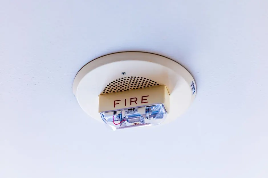 Close-up view of a ceiling-mounted fire alarm system ensuring safety in a building.